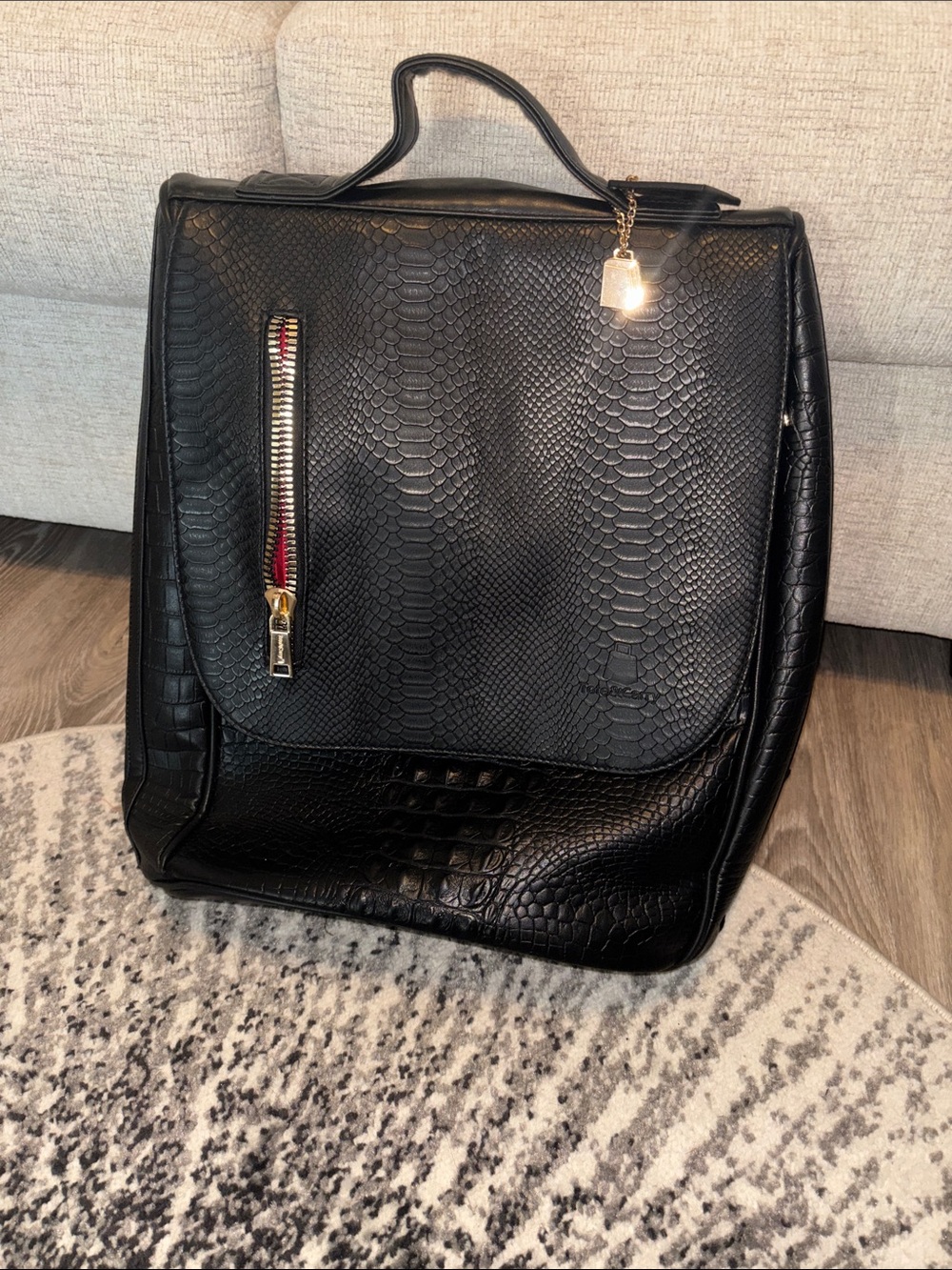 Tote & Carry Black Textured Faux-Leather Men's Backpack